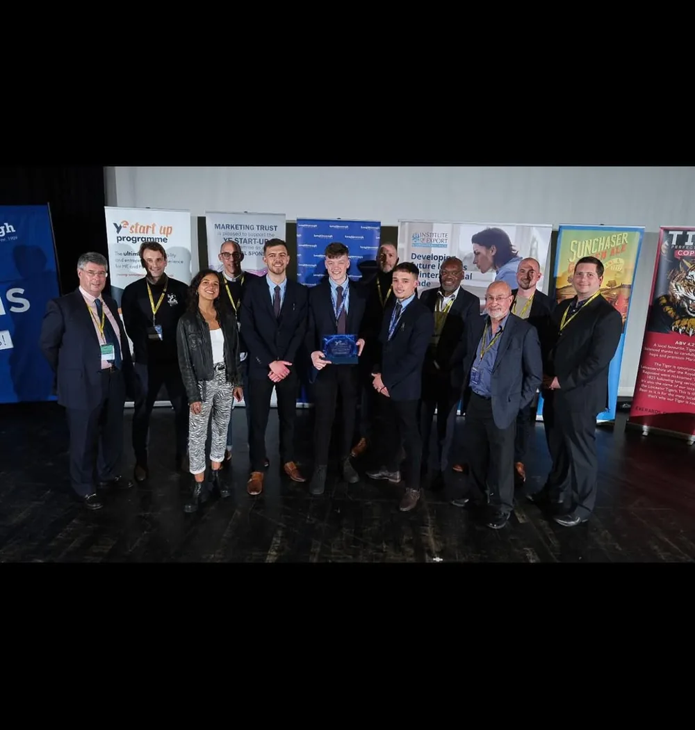 The hearNprotect team receiving the Young Enterprise award on stage